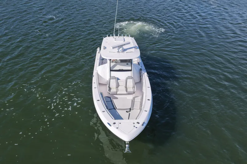 Slide: The Image of 2022 Everglades 365 Center Console boat cruising on open water. - 16