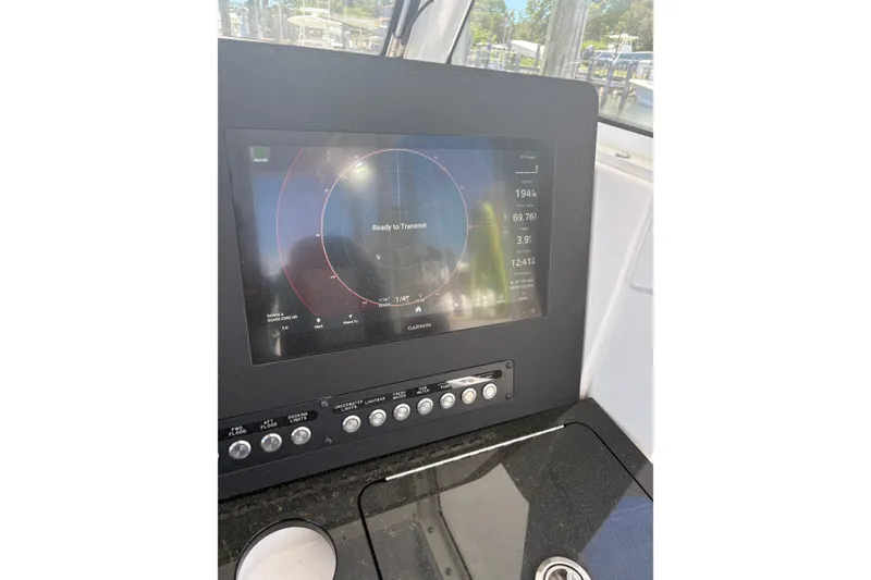 Slide: The Image of 2022 Everglades 365 Center Console boat dashboard with Garmin navigation display. - 18