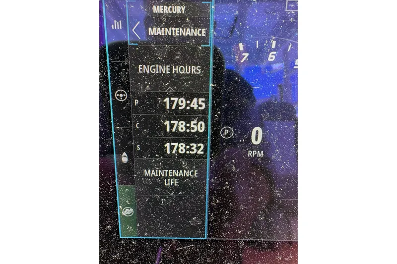 Slide: The Image of Display screen showing engine hours and RPM on 2022 Everglades 365 Center Console. - 20