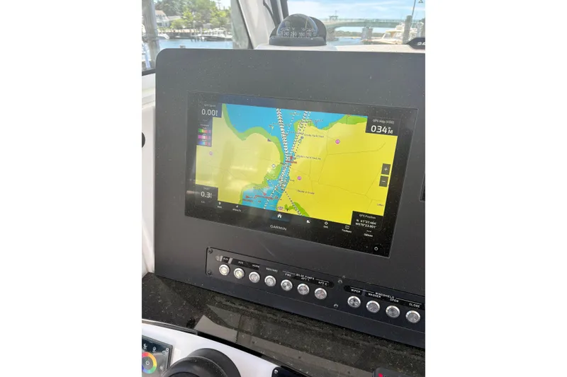 Slide: The Image of 2022 Everglades 365 Center Console GPS navigation display on boat dashboard. - 22