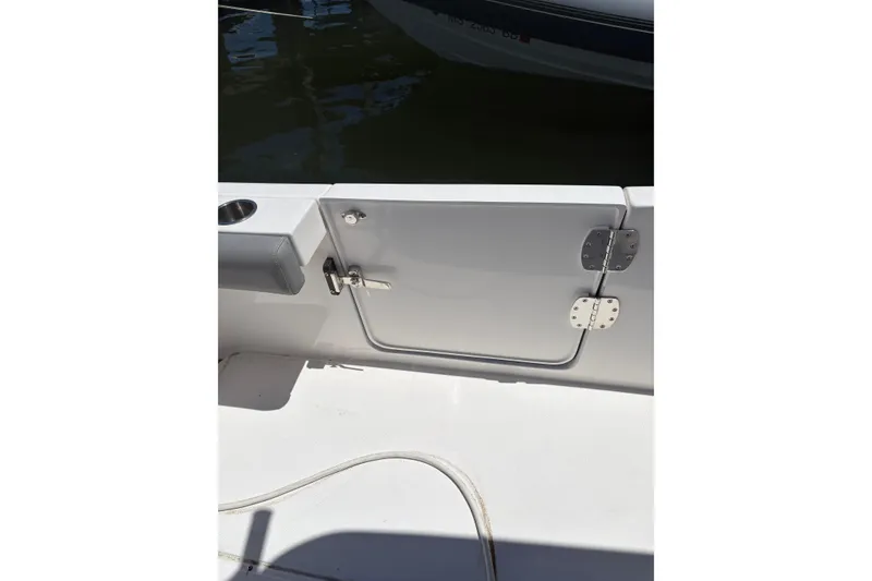 Slide: The Image of 2022 Everglades 365 Center Console boat deck with side door and cup holder. - 26