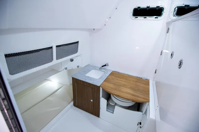Slide: The Image of Manufacturer Provided Image: 2022 Everglades 365 Center Console cabin with sink, toilet, and storage. - 27