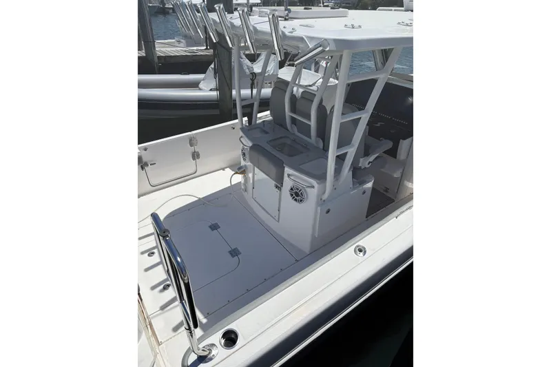 Slide: The Image of 2022 Everglades 365 Center Console boat interior with seating and storage. - 36