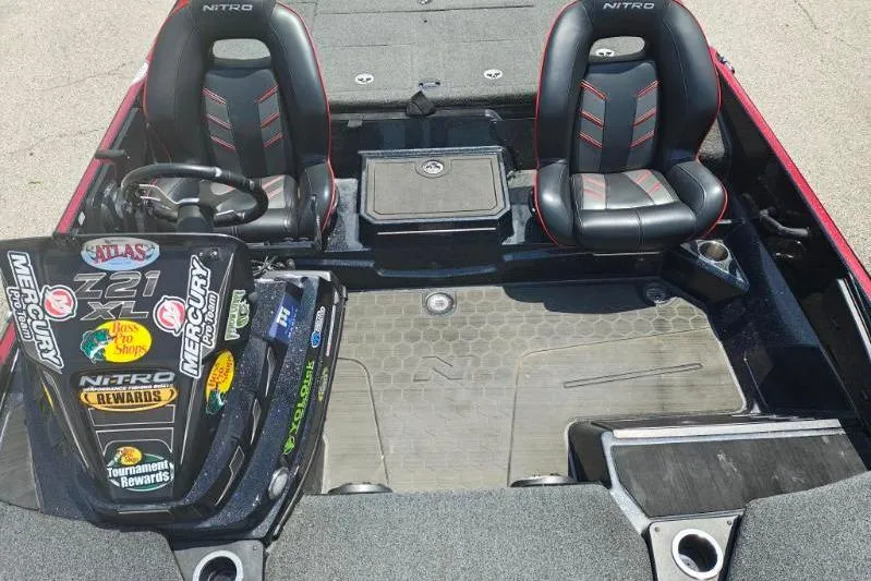 Slide: The Image of 2022 Nitro Z21 XL Pro boat interior with dual seats and branded decals. - 4