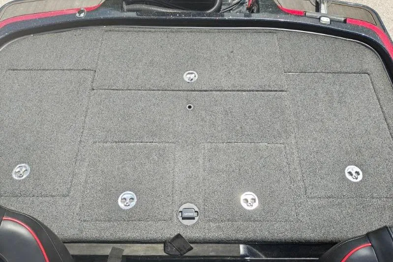 Slide: The Image of 2022 Nitro Z21 XL Pro boat deck with storage compartments and carpeted surface. - 5