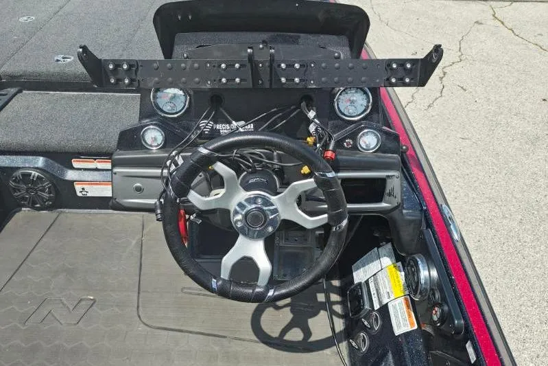 Slide: The Image of Steering console of 2022 Nitro Z21 XL Pro boat with gauges and controls. - 8