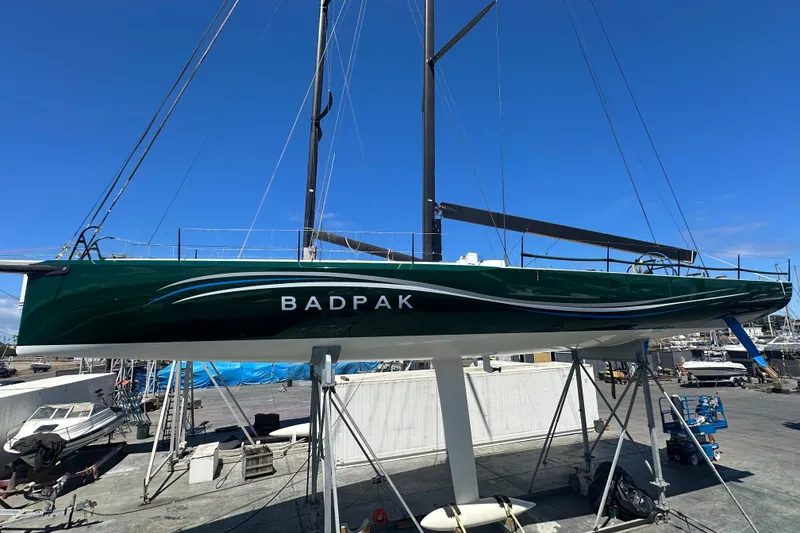 Slide: The Image of Sleek green Botin 56 sailboat named "Badpak" on dry dock, 2018 model. - 12
