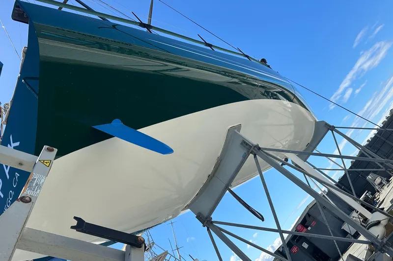 Slide: The Image of Sailboat Botin 56, 2018 model, on dry dock under clear blue sky. - 14