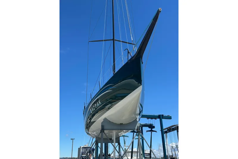 Slide: The Image of Sleek Botin 56 yacht from 2018 on a lift against a clear blue sky. - 15