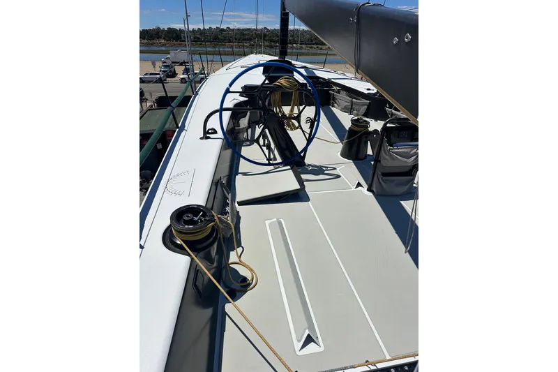 Slide: The Image of Sailing yacht deck of 2018 Botin 56, featuring winches and ropes under clear skies. - 21