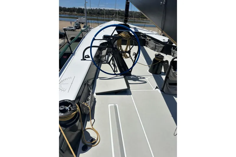 Slide: The Image of Sailing yacht deck of 2018 Botin 56, featuring winches and steering wheel. - 25