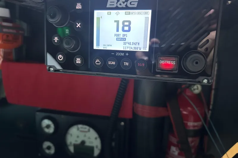 Slide: The Image of Boat navigation system display with distress button, showing coordinates and settings. Botin 56, 2018 model. - 29