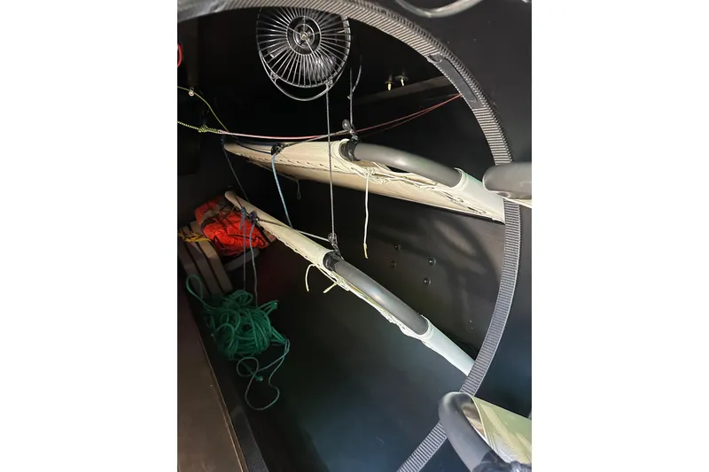 Slide: The Image of Interior of a 2018 Botin 56 sailboat, featuring ropes and equipment storage. - 30