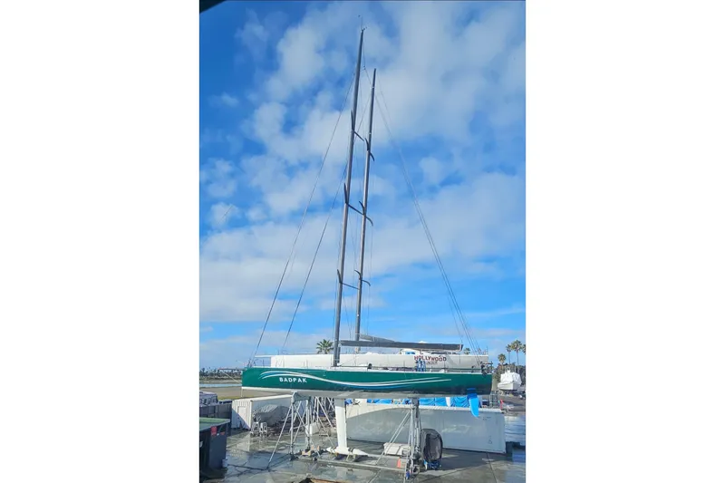 Slide: The Image of Sailboat Botin 56, 2018 model, docked under a clear blue sky. - 7