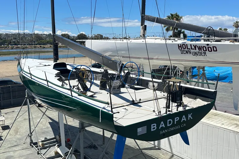 Slide: The Image of Sailboat Botin 56, 2018 model, docked in San Diego, featuring sleek design and dual steering wheels. - 8
