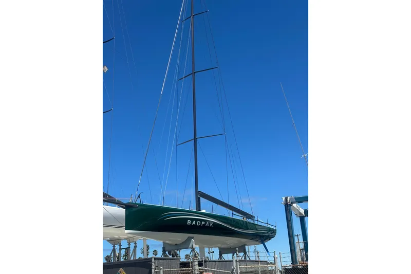 Slide: The Image of Sleek 2018 Botin 56 sailboat with tall mast against clear blue sky. - 9