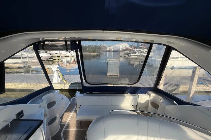 Slide: The Image of Interior view of a 2005 Regal Commodore 3560 IO yacht at a marina. - 30