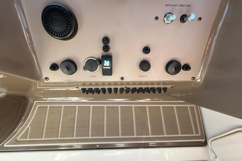 Slide: The Image of Control panel of a 2005 Regal Commodore 3560 IO boat with switches and dials. - 37