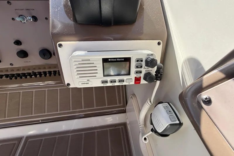 Slide: The Image of VHF radio on 2005 Regal Commodore 3560 IO boat dashboard. - 38