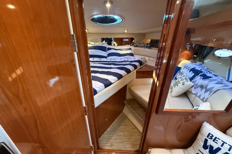 Slide: The Image of Luxurious cabin interior of 2005 Regal Commodore 3560 IO yacht with cozy bedding. - 60