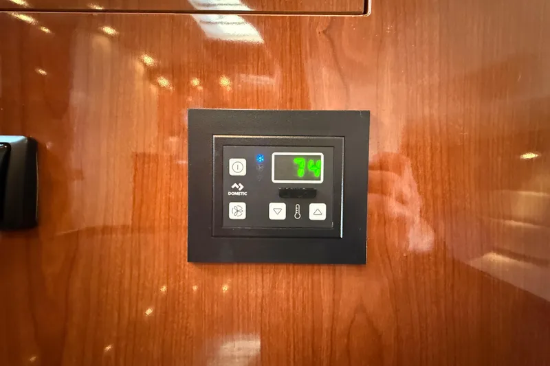 Slide: The Image of Thermostat control panel on 2005 Regal Commodore 3560 IO yacht interior. - 73