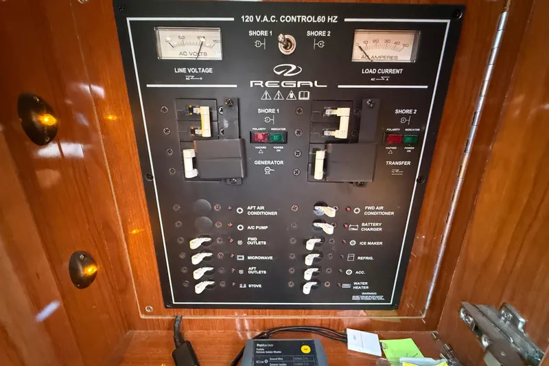 Slide: The Image of Electrical control panel of a 2005 Regal Commodore 3560 IO boat. - 74