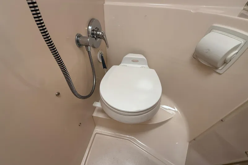 Slide: The Image of Compact bathroom in 2005 Regal Commodore 3560 IO yacht with toilet and shower. - 77