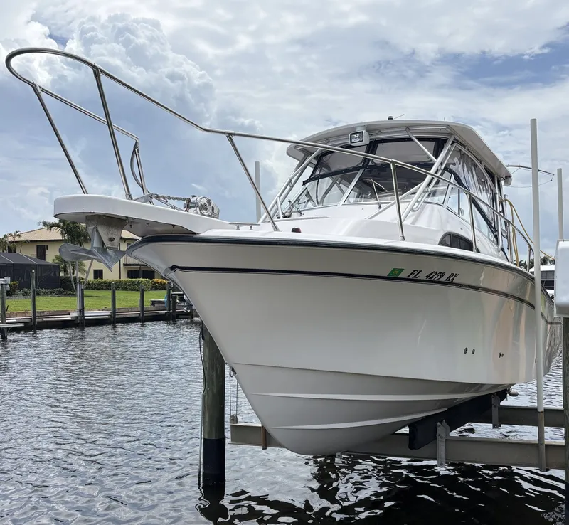 The Image of 2004 Grady-White Marlin 300 boat on a boat lift. - 0