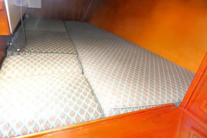 Slide: The Image of Interior cabin of a 1978 Tartan 37 sailboat with patterned cushions. - 24