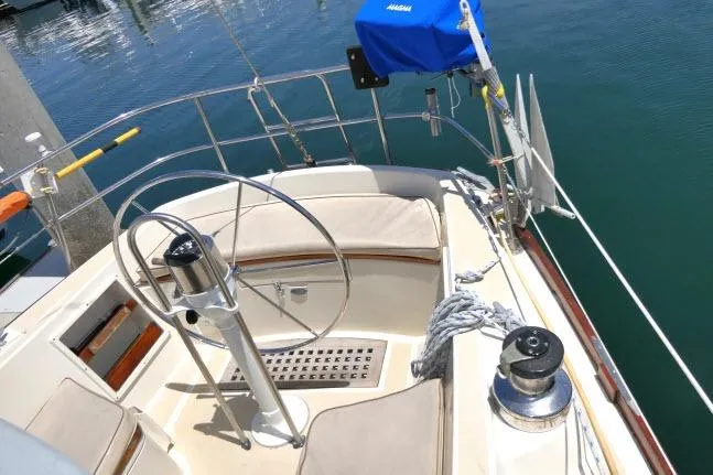 Slide: The Image of Cockpit of a 1978 Tartan 37 sailboat with steering wheel and winch. - 37