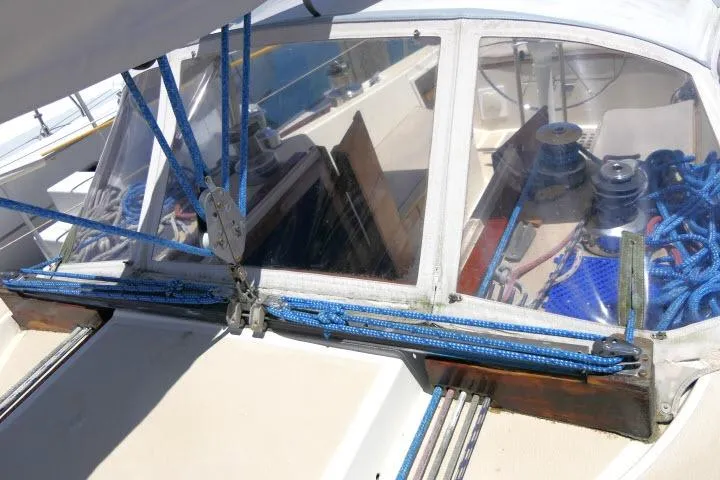 Slide: The Image of 1978 Tartan 37 sailboat cockpit with blue rigging and winches. - 41
