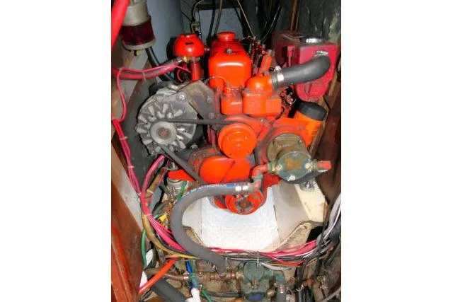 Slide: The Image of Engine of a 1978 Tartan 37 sailboat, featuring red components and wiring. - 51
