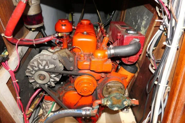 Slide: The Image of Engine compartment of a 1978 Tartan 37 sailboat with visible wiring and components. - 52
