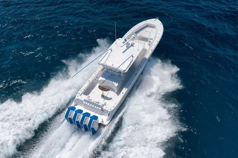 Slide: The Image of HCB 53 Suenos 2023 boat cruising on open sea, aerial view. - 1