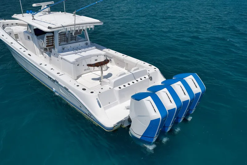 Slide: The Image of 2023 HCB 53 Suenos boat with four outboard engines on open sea. - 16