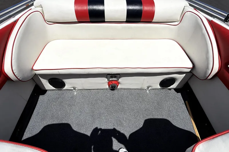 Slide: The Image of 1979 Charger 30 Cuddy boat interior with red and white seating and carpeted floor. - 10
