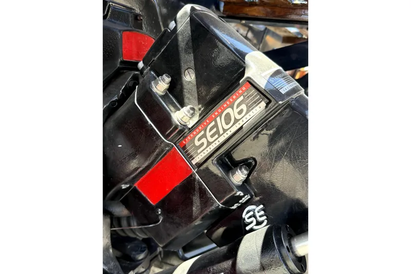 Slide: The Image of Close-up of a 1979 Charger 30 Cuddy engine component with SE106 label. - 8
