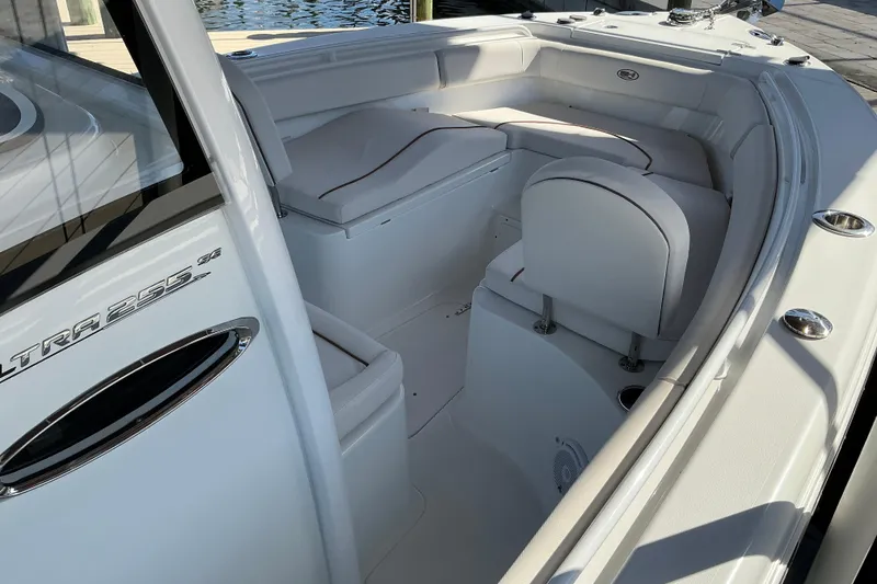 Slide: The Image of 2019 Sea Hunt Ultra 255 SE boat interior with cushioned seating and sleek design. - 20