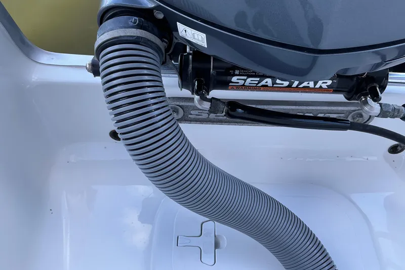 Slide: The Image of Close-up of SeaStar hydraulic steering system on 2019 Sea Hunt Ultra 255 SE boat. - 28
