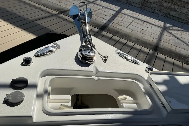 Slide: The Image of Bow of 2019 Sea Hunt Ultra 255 SE with anchor and storage compartment. - 38