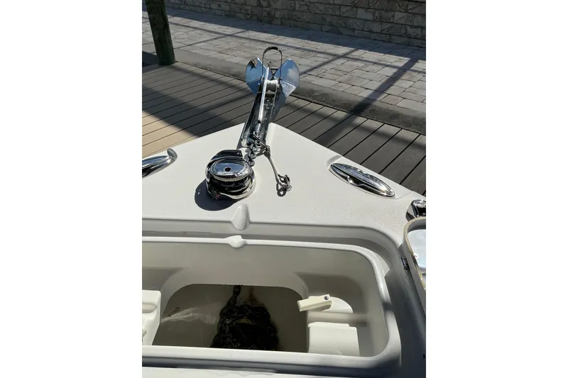 Slide: The Image of Bow of 2019 Sea Hunt Ultra 255 SE with anchor and chain compartment. - 39
