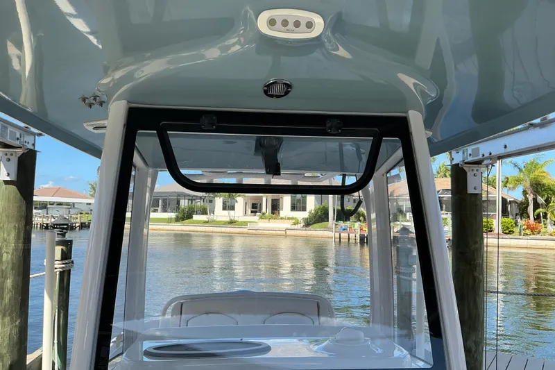 Slide: The Image of 2019 Sea Hunt Ultra 255 SE boat interior with waterfront view. - 42