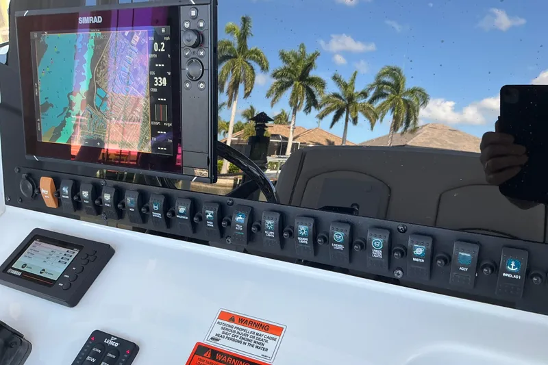 Slide: The Image of Control panel of a 2019 Sea Hunt Ultra 255 SE boat with navigation display. - 44