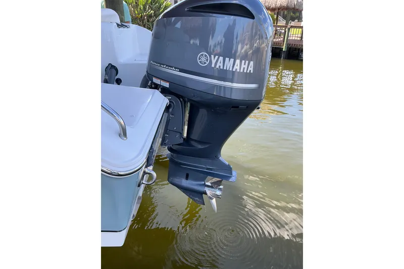 Slide: The Image of 2019 Sea Hunt Ultra 255 SE with Yamaha outboard motor in water. - 55