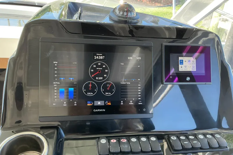 Slide: The Image of Dashboard of a 2022 Beneteau Antares 9 with Garmin navigation display. - 11