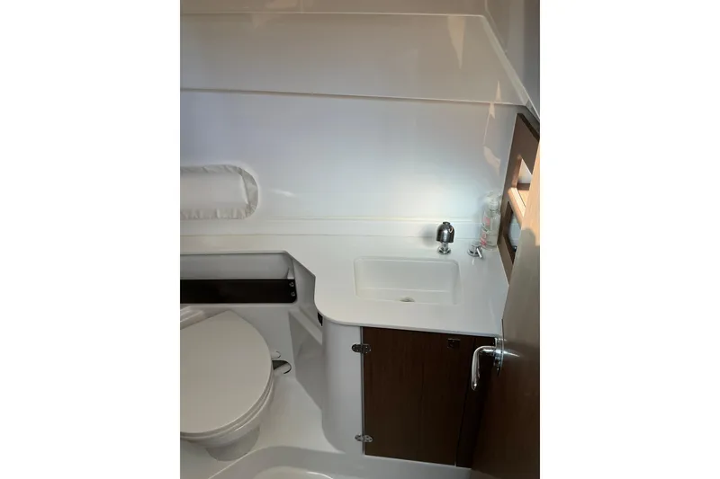 Slide: The Image of Bathroom interior of 2022 Beneteau Antares 9 boat, featuring sink and toilet. - 18