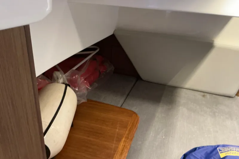 Slide: The Image of Interior storage area of a 2022 Beneteau Antares 9 boat with life jackets and equipment. - 22