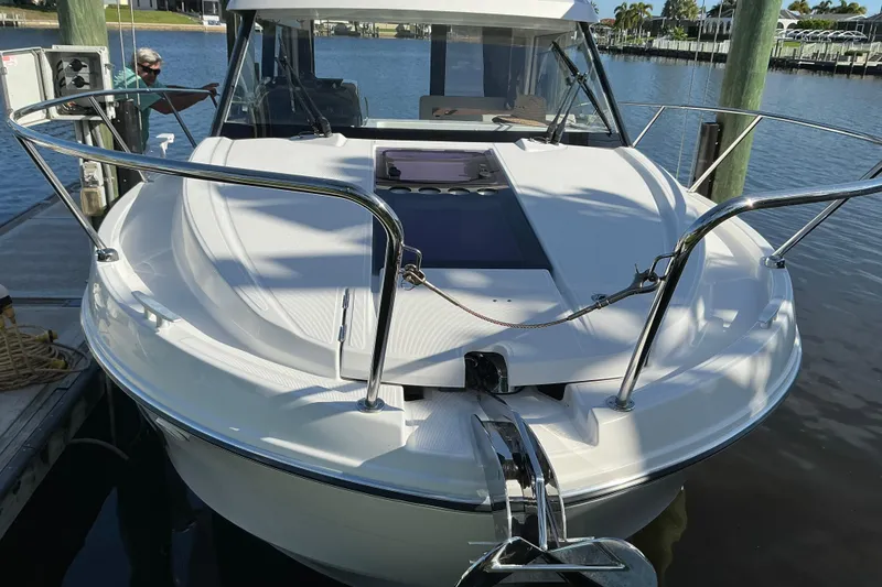 Slide: The Image of 2022 Beneteau Antares 9 docked, showcasing sleek design and spacious deck. - 3