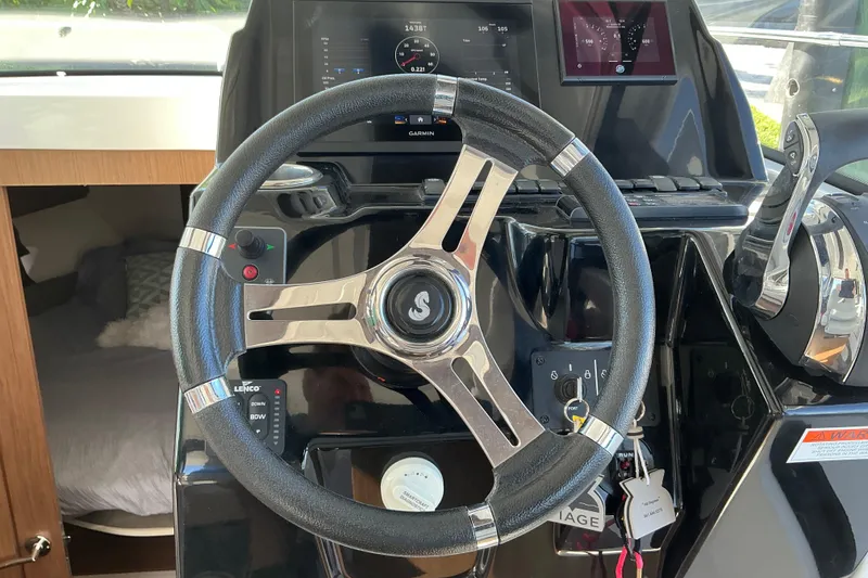 Slide: The Image of Steering wheel and dashboard of a 2022 Beneteau Antares 9 boat. - 31