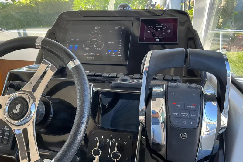Slide: The Image of Cockpit of 2022 Beneteau Antares 9 with steering wheel and control panel. - 36